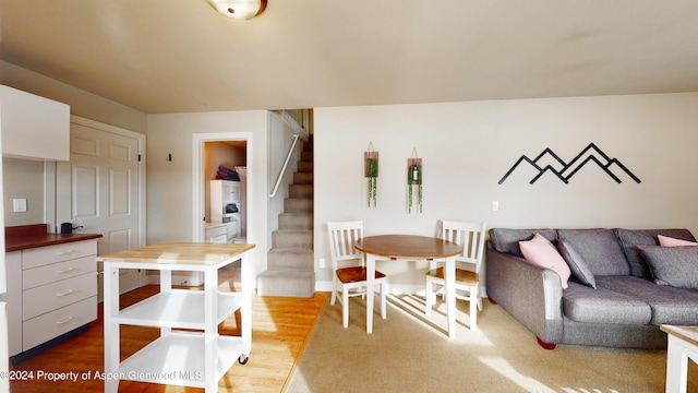 interior space with light wood finished floors and stairway