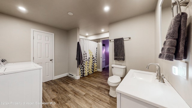 bathroom with washer and clothes dryer, recessed lighting, toilet, vanity, and wood finished floors