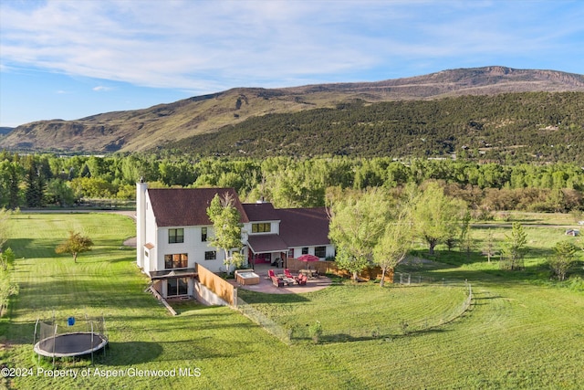 drone / aerial view featuring a rural view and a mountain view