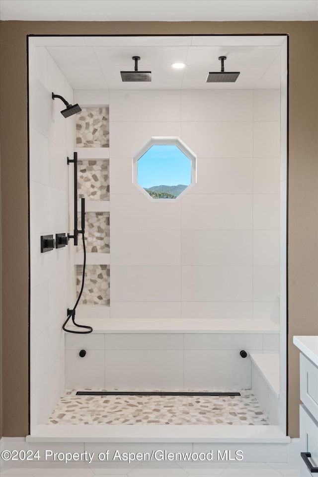 bathroom with a tile shower