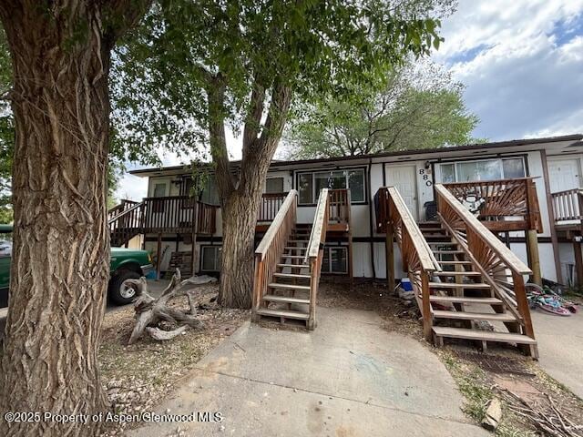 872 Russell St, Craig, CO 81625 - rear view of house featuring stairs and a wooden deck