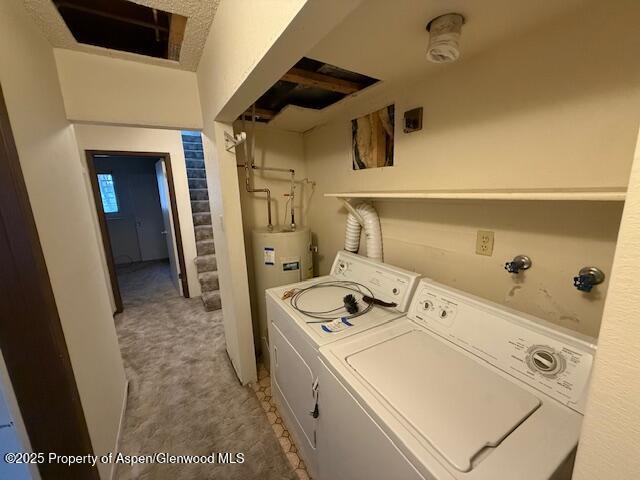 872 Russell St, Craig, CO 81625 - laundry area featuring washer / dryer, light carpet, and electric water heater