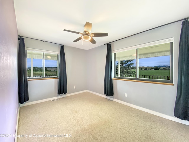 unfurnished room featuring ceiling fan