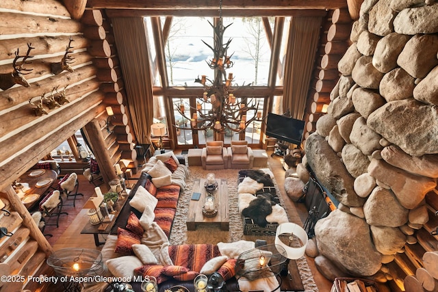 unfurnished living room featuring hardwood / wood-style flooring and log walls