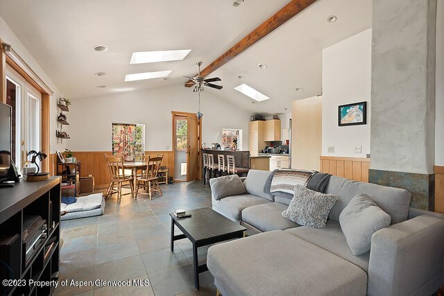 2800 Cedar Dr, Basalt, CO 81621 - living room featuring a skylight, a wainscoted wall, and wood walls