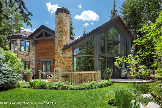10 Ute Pl, Aspen, CO 81611 - rear view of property with a chimney, a sunroom, and a yard