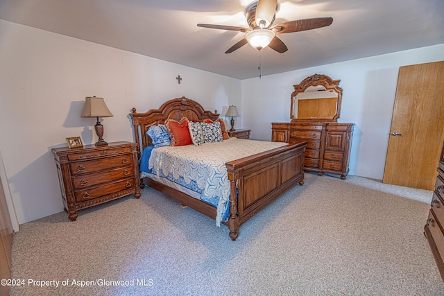 bedroom featuring light carpet and ceiling fan