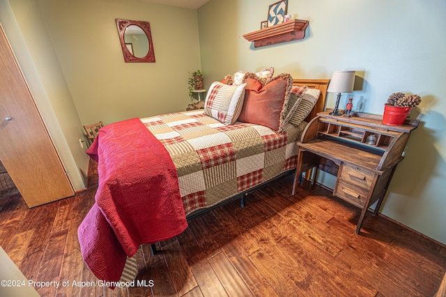 bedroom featuring wood finished floors