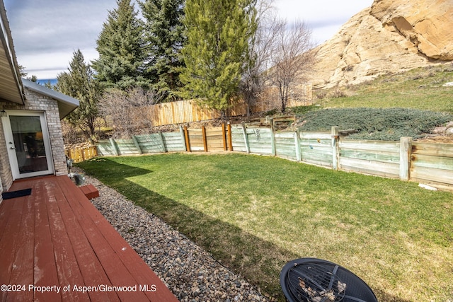 view of yard with a wooden deck