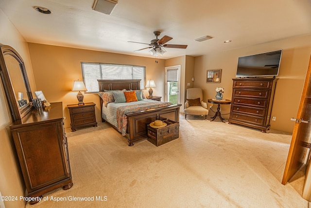 bedroom featuring light carpet, a ceiling fan, and recessed lighting