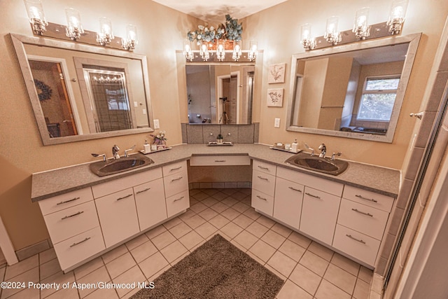 bathroom with tile patterned flooring and vanity
