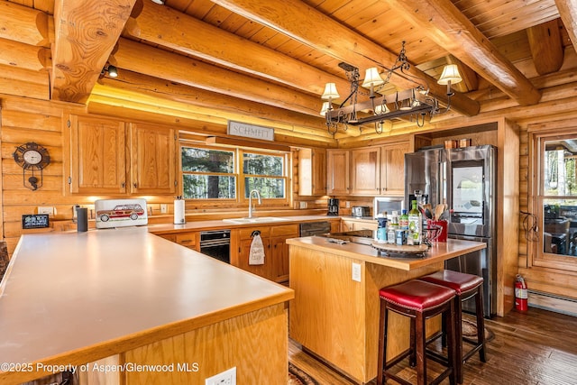 3 Hazel Lake Dr, Cimarron, CO 81220 - kitchen with smart refrigerator, a sink, dark wood-type flooring, wooden ceiling with exposed beams, and light countertops