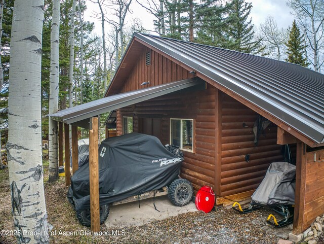 3 Hazel Lake Dr, Cimarron, CO 81220 - view of property exterior featuring log veneer siding, metal roof, and board and batten siding