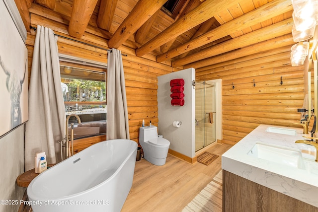 3 Hazel Lake Dr, Cimarron, CO 81220 - full bathroom with rustic walls, a shower stall, wood finished floors, a soaking tub, and double vanity