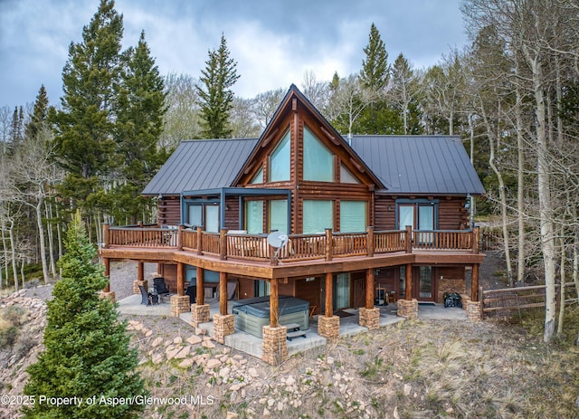 3 Hazel Lake Dr, Cimarron, CO 81220 - rear view of house with log exterior, a patio area, and a deck