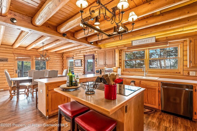 3 Hazel Lake Dr, Cimarron, CO 81220 - kitchen featuring stainless steel dishwasher, a chandelier, wood ceiling with exposed beams, a sink, and a kitchen island