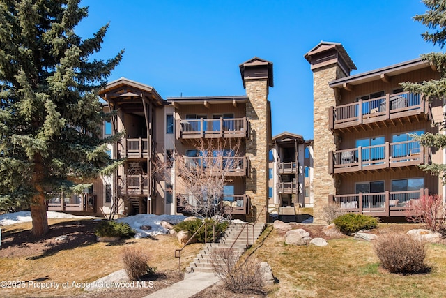 35 Upper Woodbridge Rd Unit 34Cd, Snowmass Village, CO 81615 - view of apartment building / complex featuring stairway