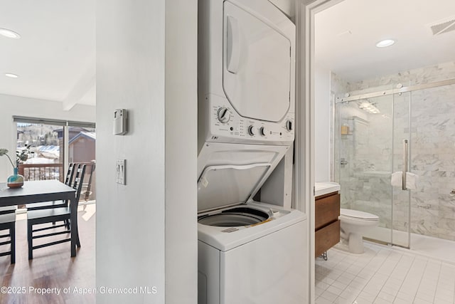 35 Upper Woodbridge Rd Unit 34Cd, Snowmass Village, CO 81615 - laundry room featuring stacked washer / dryer, recessed lighting, and light tile patterned floors