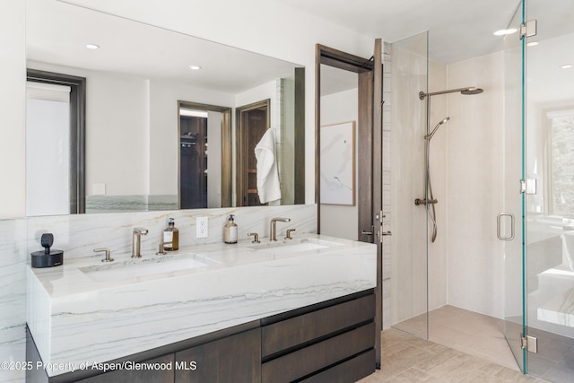 62 Bennett Ct, Aspen, CO 81611 - bathroom featuring a shower stall, double vanity, and recessed lighting