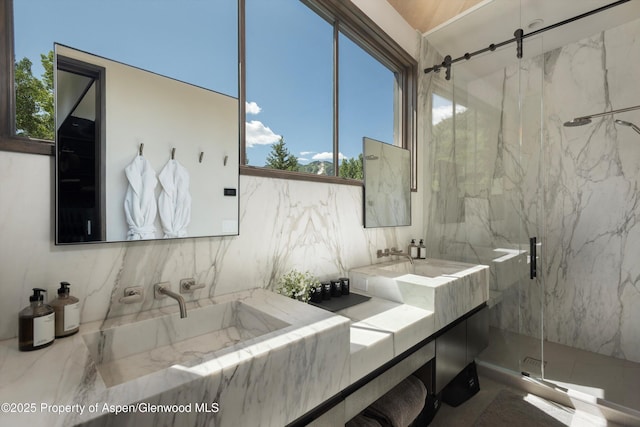 62 Bennett Ct, Aspen, CO 81611 - bathroom with a marble finish shower, plenty of natural light, and double vanity