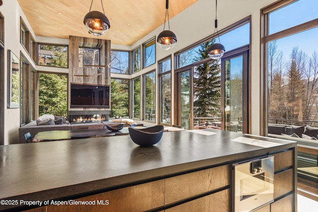 62 Bennett Ct, Aspen, CO 81611 - sunroom with healthy amount of natural light and wine cooler