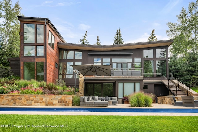 62 Bennett Ct, Aspen, CO 81611 - back of property featuring an outdoor hangout area, stairs, and a patio area