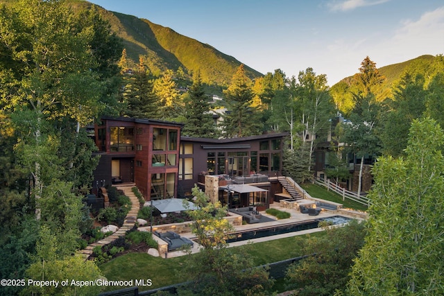 62 Bennett Ct, Aspen, CO 81611 - back of house with stairway, a mountain view, a balcony, and a patio