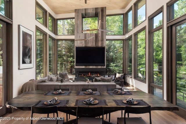 62 Bennett Ct, Aspen, CO 81611 - sunroom with wood finished floors and a high ceiling