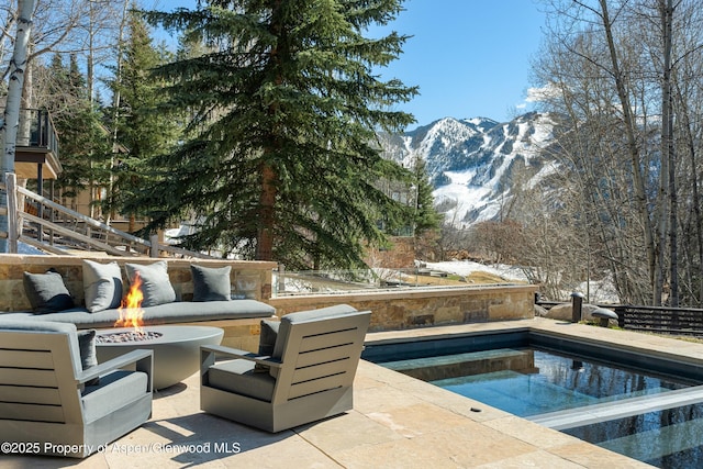 62 Bennett Ct, Aspen, CO 81611 - view of pool featuring a fire pit, a mountain view, a patio, and stairway
