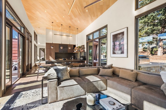62 Bennett Ct, Aspen, CO 81611 - living area with wood ceiling, wood finished floors, a high ceiling, and recessed lighting