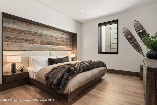 62 Bennett Ct, Aspen, CO 81611 - bedroom with wood finished floors and recessed lighting