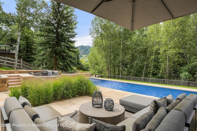 62 Bennett Ct, Aspen, CO 81611 - view of pool featuring an outdoor hangout area, a fenced backyard, a mountain view, and a patio area