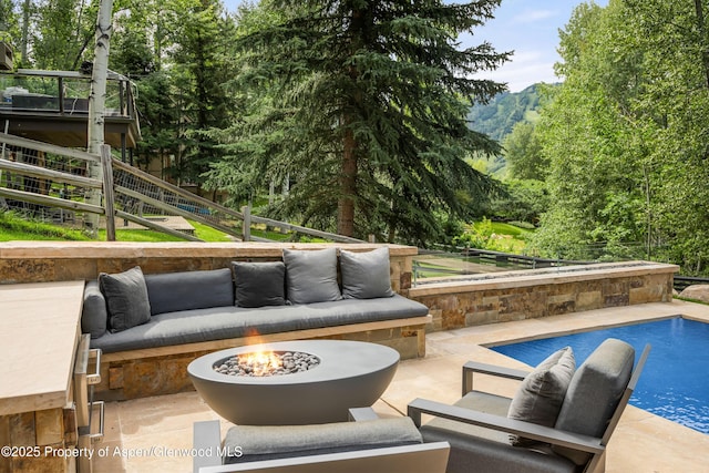 62 Bennett Ct, Aspen, CO 81611 - view of patio / terrace with an outdoor living space with a fire pit, an outdoor pool, a mountain view, and stairs