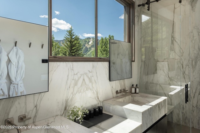 62 Bennett Ct, Aspen, CO 81611 - bathroom with a marble finish shower and vanity