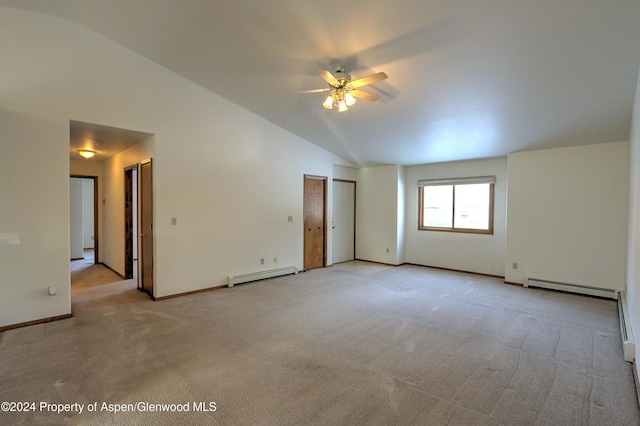 carpeted spare room featuring ceiling fan, high vaulted ceiling, and a baseboard heating unit