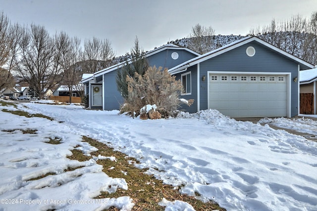 single story home with a garage