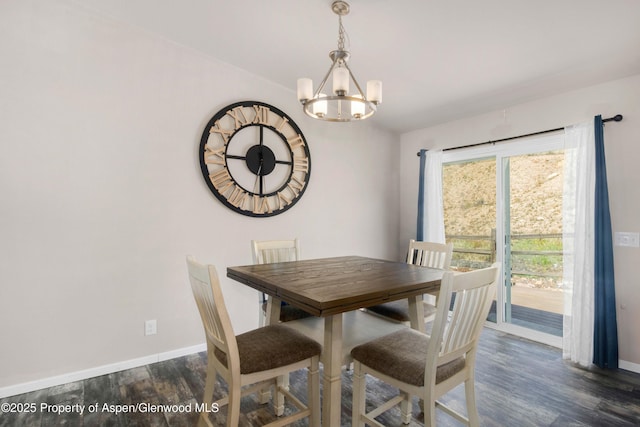 2432 Pioneer Way, Rifle, CO 81650 - dining area with a chandelier, dark wood finished floors, and baseboards