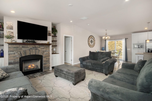 2432 Pioneer Way, Rifle, CO 81650 - living area with a chandelier, light wood-type flooring, baseboards, a fireplace, and recessed lighting