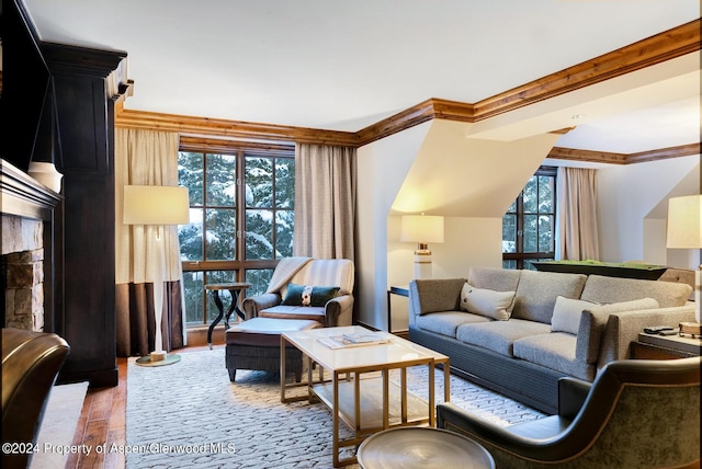 living room featuring plenty of natural light, ornamental molding, and hardwood / wood-style flooring