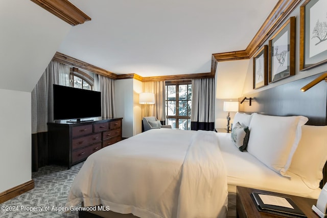 carpeted bedroom with ornamental molding