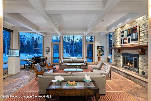 living room featuring a stone fireplace, coffered ceiling, beam ceiling, and stone tile floors