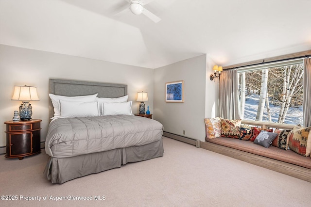 bedroom with a baseboard heating unit, carpet, and a ceiling fan