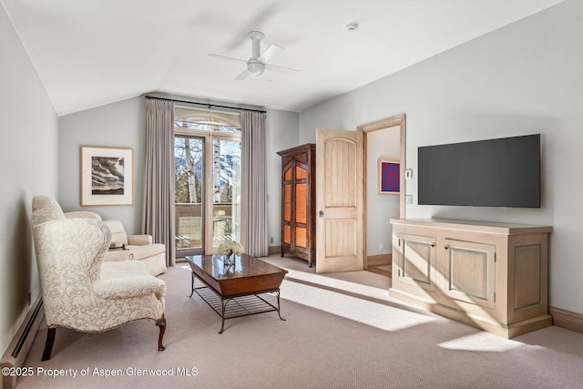 living area featuring ceiling fan, a baseboard radiator, light colored carpet, baseboards, and vaulted ceiling