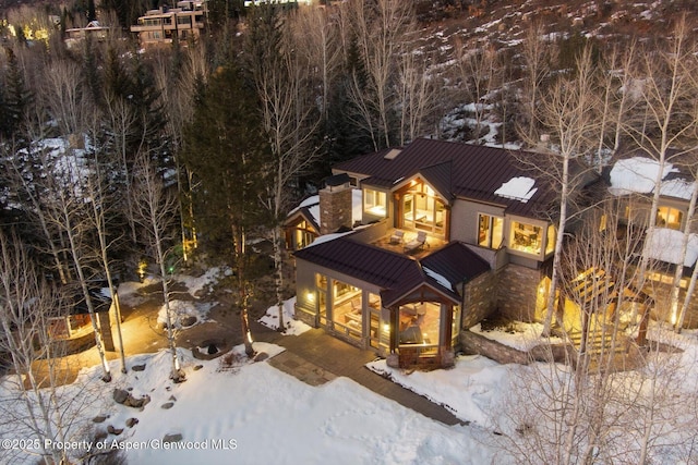 chalet / cabin featuring metal roof and a standing seam roof