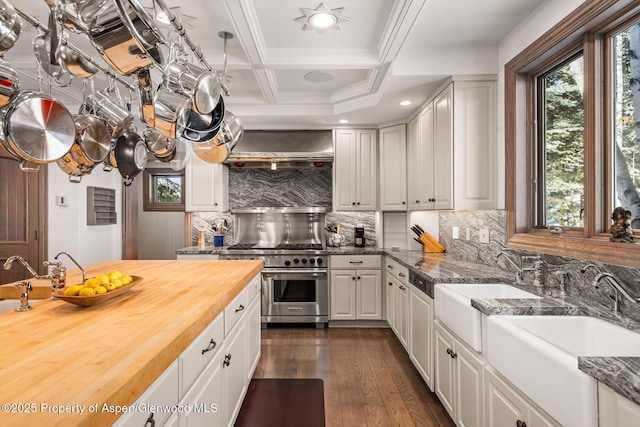 645 Willoughby Way, Aspen, CO 81611 - kitchen featuring butcher block countertops, double oven range, dark wood-style floors, wall chimney range hood, and beamed ceiling