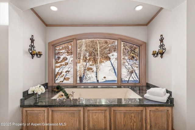 interior details featuring ornamental molding and recessed lighting