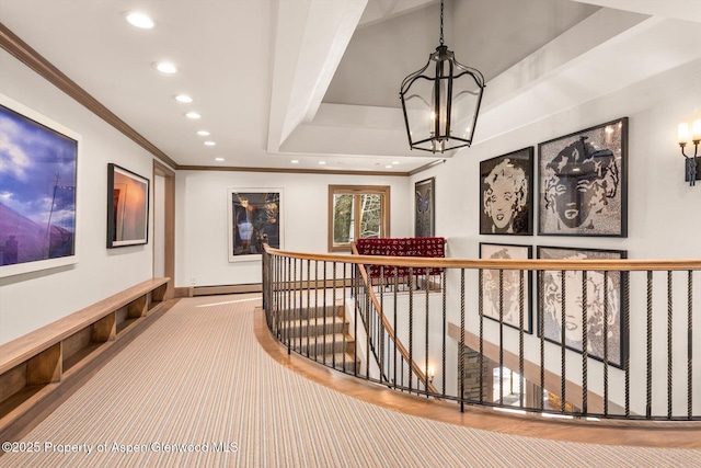 corridor featuring recessed lighting, an inviting chandelier, ornamental molding, a baseboard heating unit, and an upstairs landing