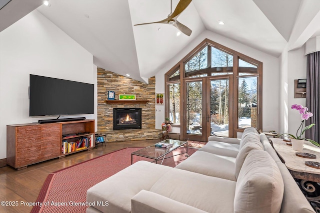 645 Willoughby Way, Aspen, CO 81611 - living area featuring a ceiling fan, wood finished floors, a fireplace, and high vaulted ceiling