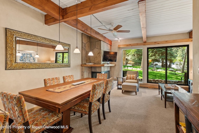 610 S W End St Unit D105, Aspen, CO 81611 - carpeted dining room with beam ceiling, a fireplace, and ceiling fan