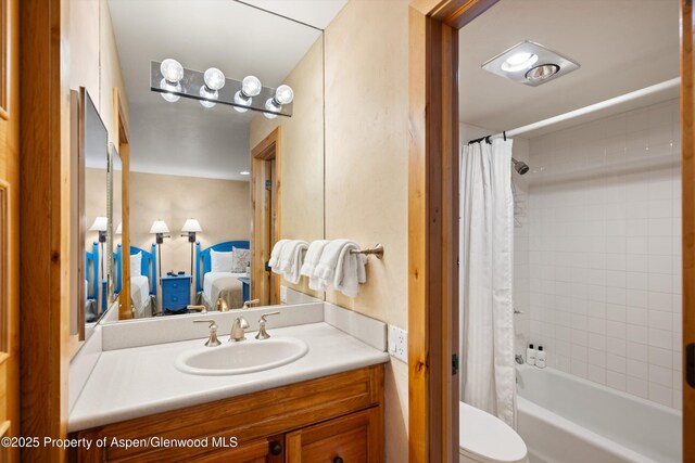 610 S W End St Unit D105, Aspen, CO 81611 - ensuite bathroom with vanity, shower / bath combo with shower curtain, and toilet